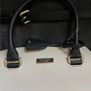 Brand new: Kate Spade leather black/cream full zipper bag. Short and long strap.